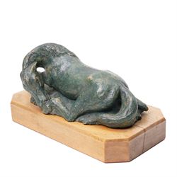 Mid-20th century painted terracotta figure of a recumbent horse, including wooden plinth W31cm
