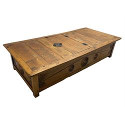 Large teak low table or Jodang chest, possibly Indonesian, the rectangular top with hinged compartment revealing storage space, fitted with wrought metal handles and hinges, the sides and ends carved and painted with fan motifs, on stile supports