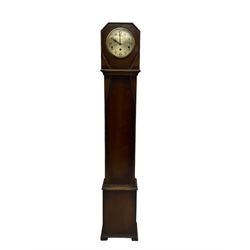  1950’s - 8-day oak cased grandmother clock, flat top with chamfered corners, long trunk with applied beadwork decoration, rectangular plinth raised on bracket feet, circular silvered dial with Arabic numerals and spade hands, three train Westminster chiming movement chiming the quarters and hours on 8 gong rods. With pendulum.  