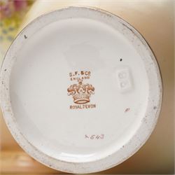 Pair of early 20th century S Fielding & Co. Royal Devon blush ivory ground vases, H38cm