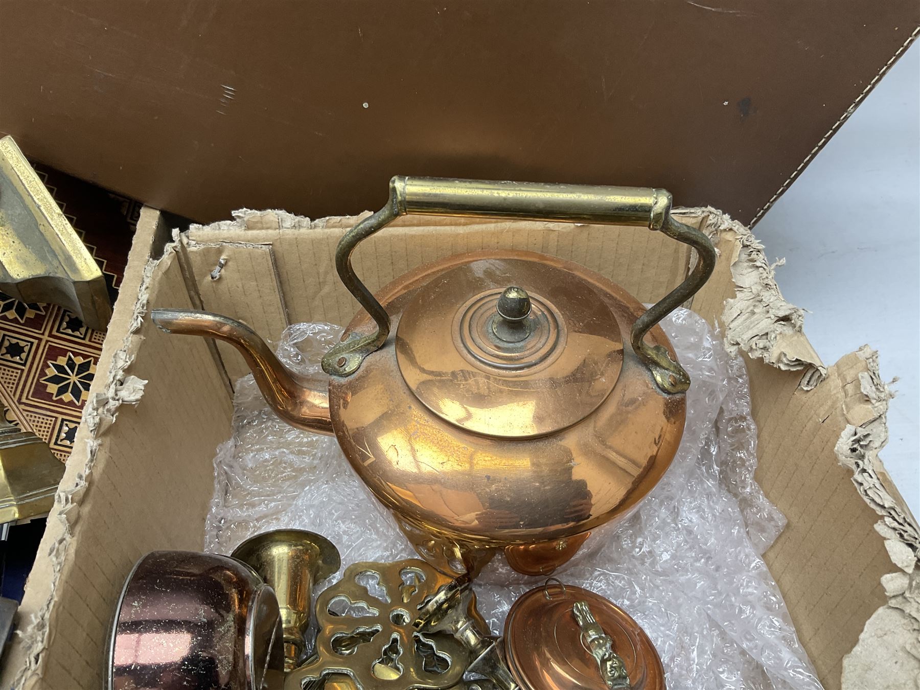 Collection of silver plated cased cutlery including part canteens and butter knives, together with other metal ware including J&J Siddons iron, horse brasses and a copper kettle, 1970s children's annuals including Beano, two handbags and three suitcases, vintage tins etc, in four boxes 