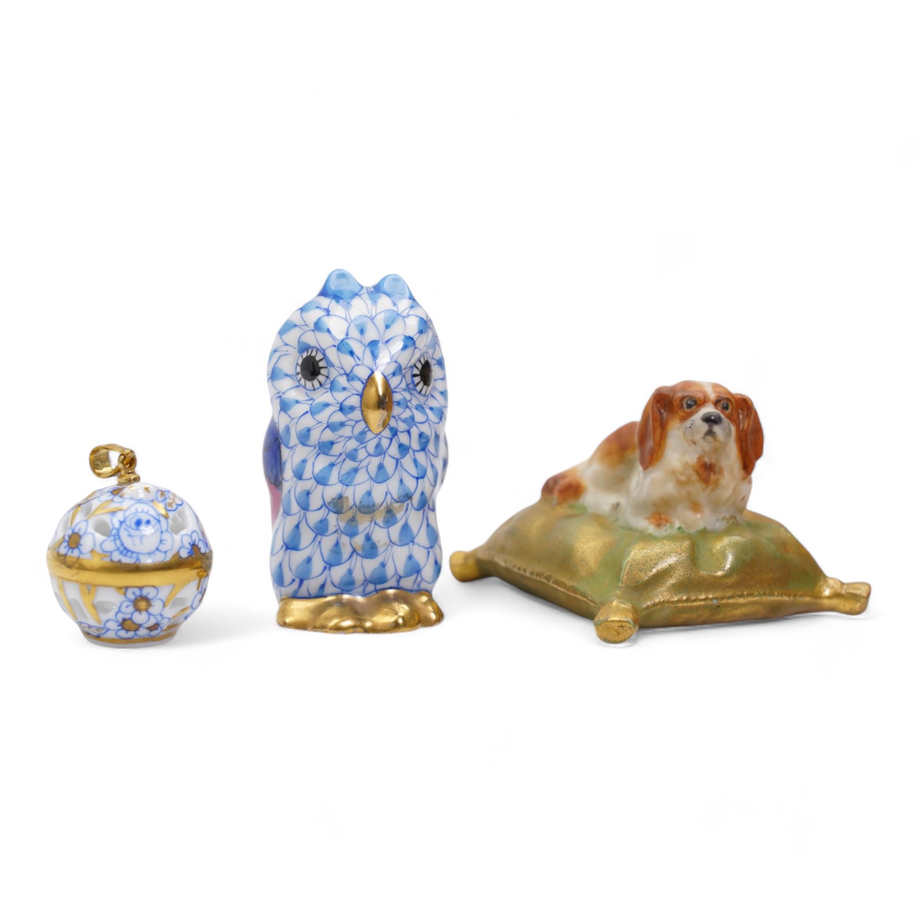 Herend miniature porcelain model of an owl and pierced pendant with 18k gold plate bale, together with an early 20th century Royal Worcester miniature porcelain model of a King Charles Spaniel seated on a cushion, L4.5cm (3)