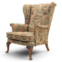 Parker Knoll - pair of mid-20th century wing back armchairs, upholstered in tapestry fabric, raised on cabriole legs