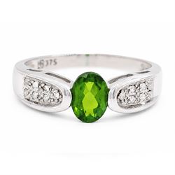 9ct white gold tsavorite garnet and diamond ring, single oval cut garnet with pave set dia...