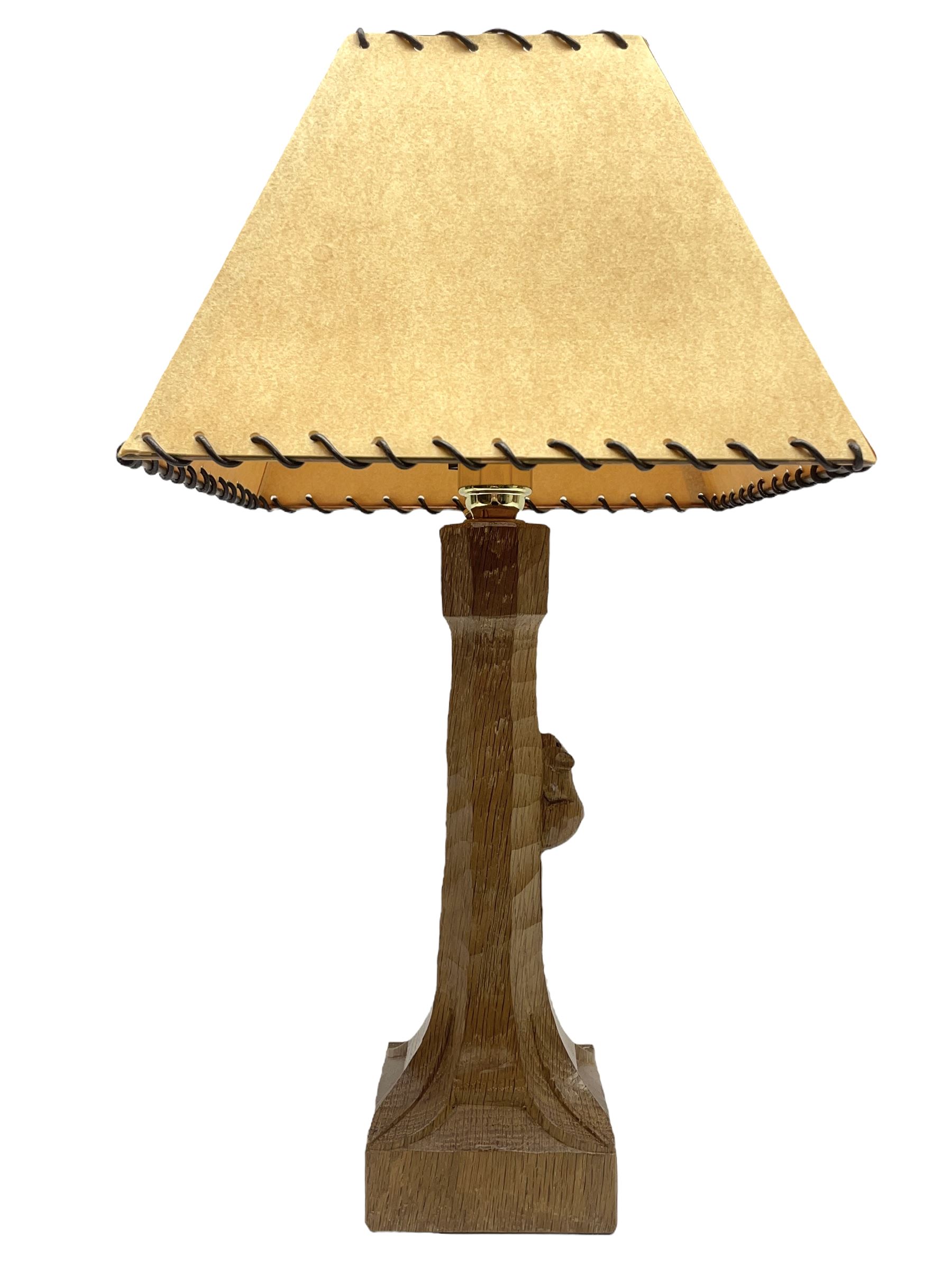 'Mouseman' tooled oak table lamp, the octagonal tapered stem carved with mouse signature, with shade, by Robert Thompson of Kilburn