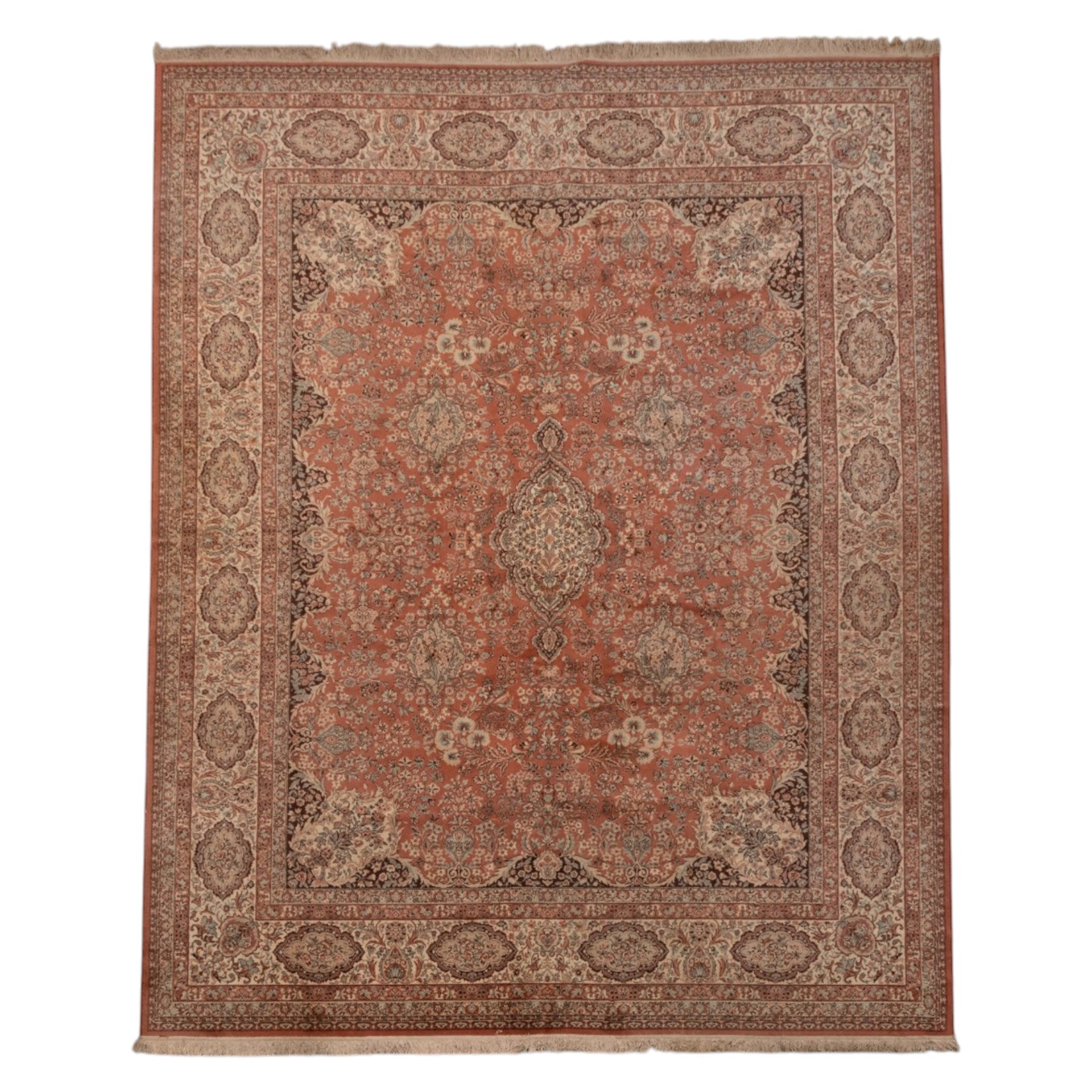 Persian vermillion ground Kashan rug, the busy field decorated with a central floral pole medallion, surrounded by trailing foliage and profusely woven floral patterns and bouquets, the dark indigo spandrels and multiple guard bands with similar floral decoration and stylised spandrels