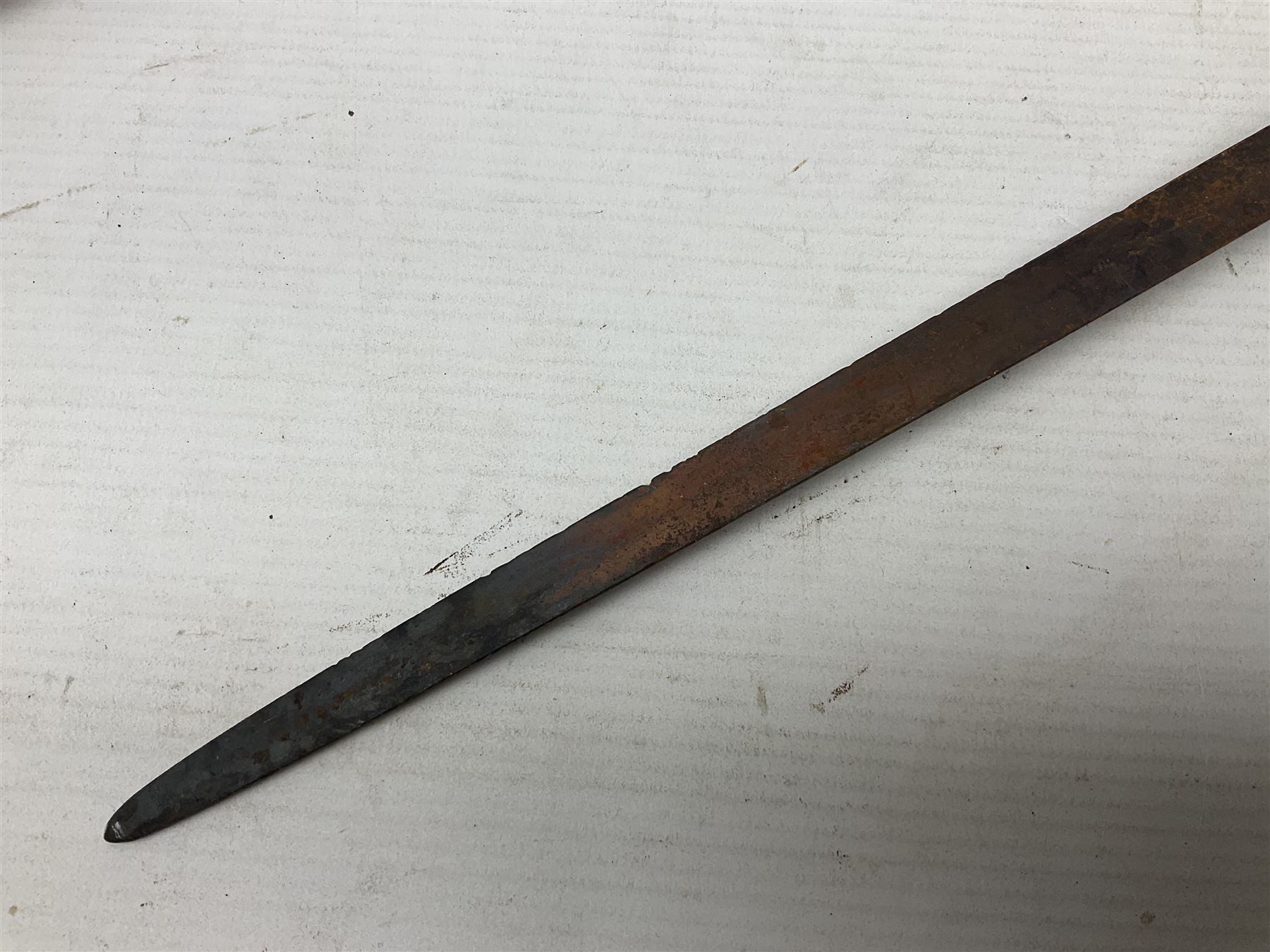 Victorian 1845 pattern infantry officer's sword the 82cm sharpened fullered steel blade with traces of decoration, brass gothic hilt incorporating Victorian cypher, folding back guard, stepped pommel with acanthus leaf backstrap and wire-bound wooden grip with traces of original fish skin covering L96cm overall; together with a reproduction Scottish style basket hilted sword; both lacking scabbard (2)