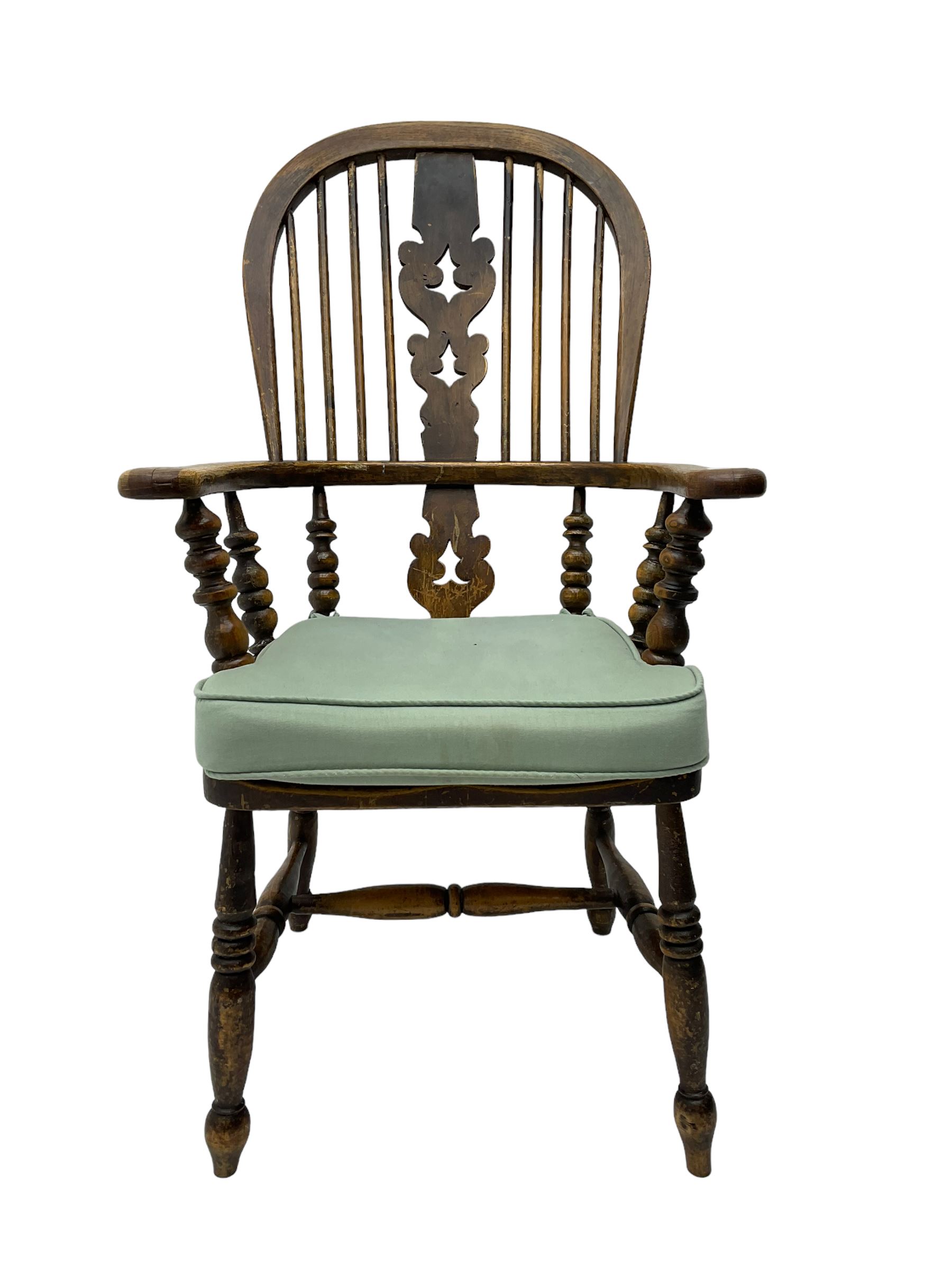 Late 19th century Yorkshire Windsor armchair, high stick back with pierced and fretwork splat, turned supports joined by H-stretcher