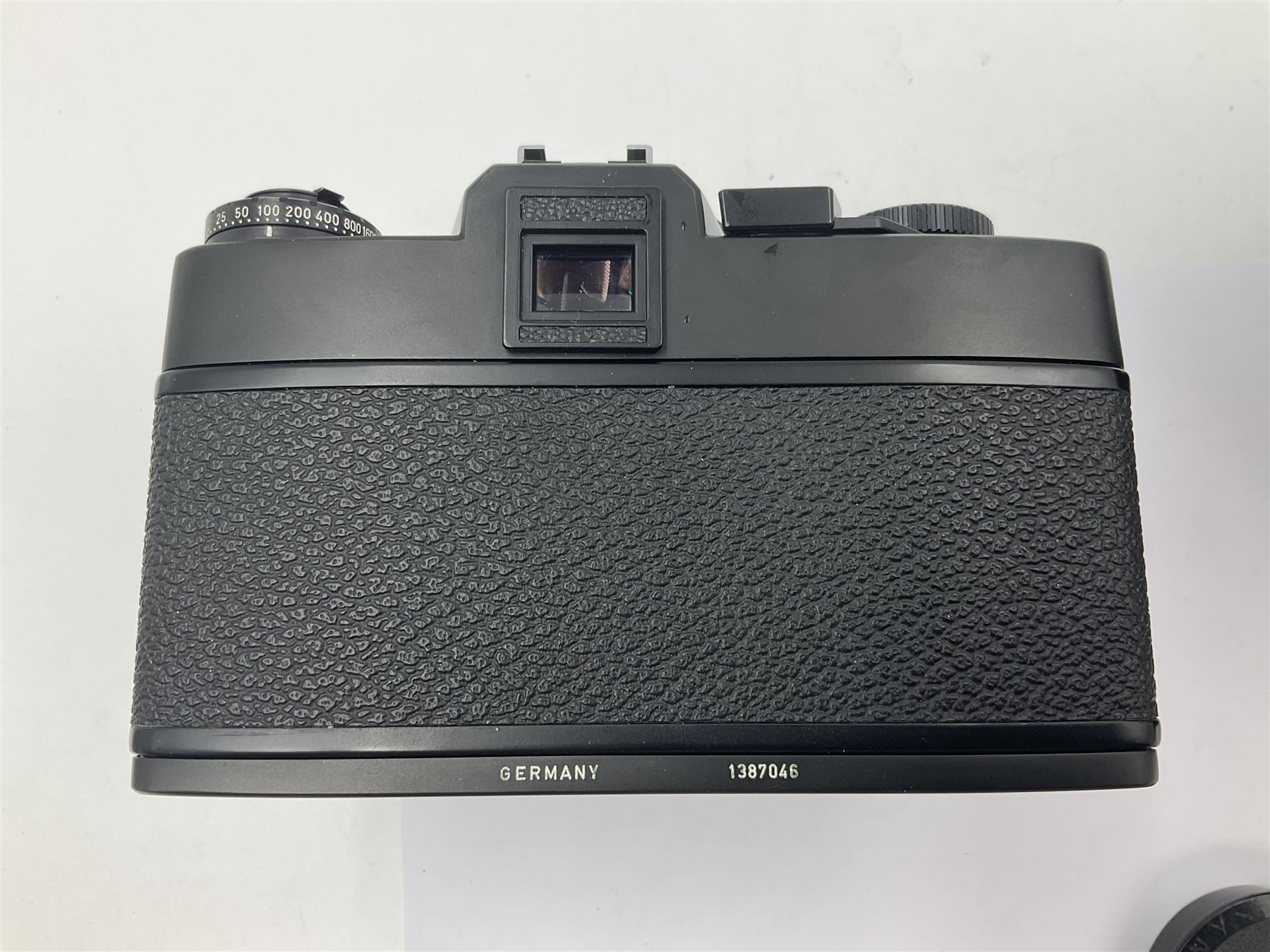 Leitz Leicaflex SL2 camera body, serial no.1387046, with 'Summicron-R 1:2/50 Leitz Wetzlar' lens, serial no. 2273397, within a leather Leitz lens hood 