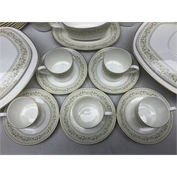 Royal Doulton Paisley pattern tea and dinner service for twelve, comprising dinner plates, side plates, soup bowls, dessert bowls, tea plates, two lidded tureens, sauce boat and saucer, sucrier and jug, oval serving dish and teacups and saucers