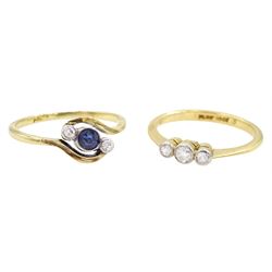 Early 20th century milgrain set three stone old cut diamond ring, stamped 18ct Plat and a 15ct gold three stone sapphire and diamond crossover ring