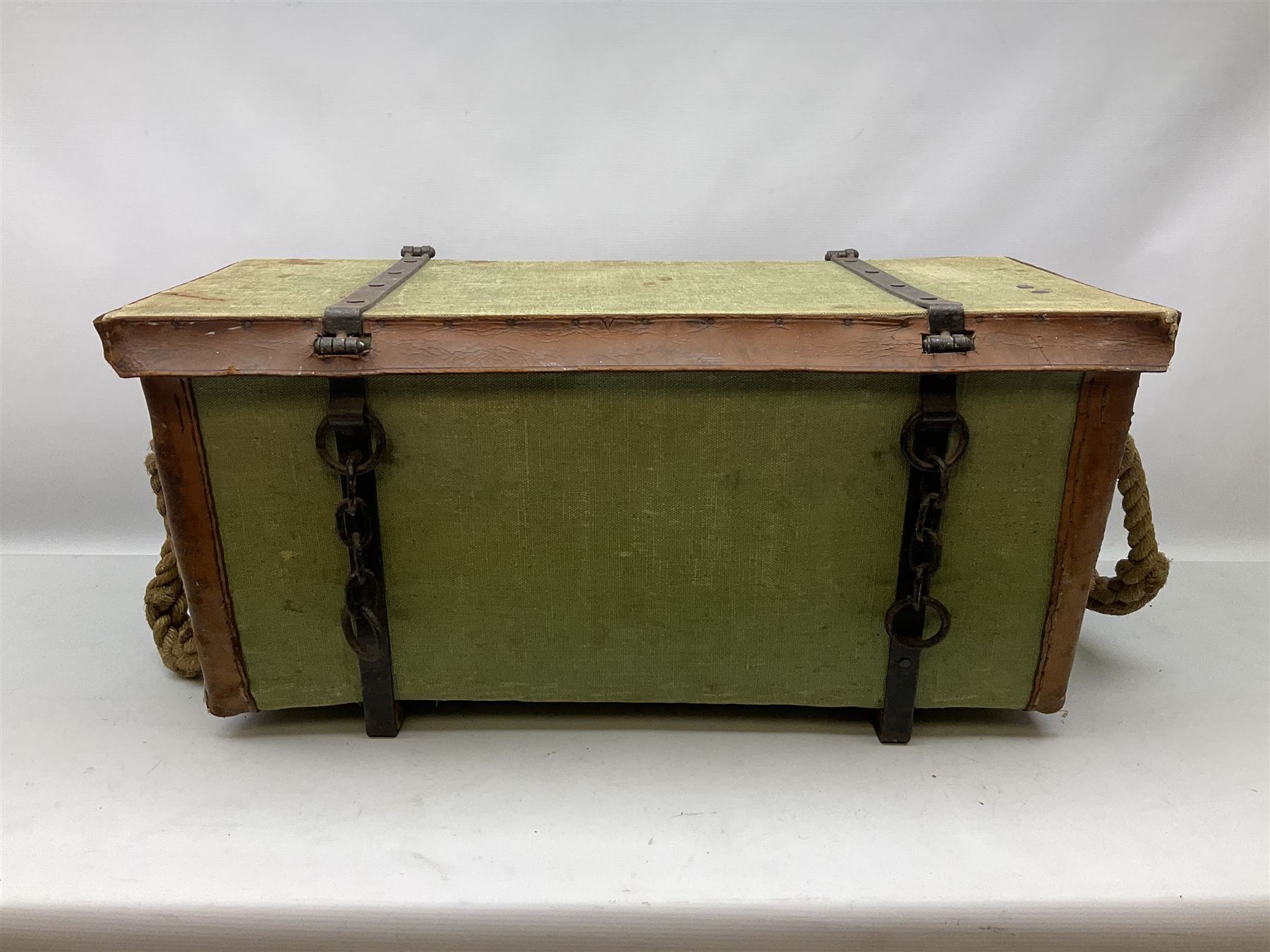 WW2 British Army RAMC 'Regimental Medical Pannier', well marked externally and dated 1941, stamped May 1943 internally, canvas covered wicker form with leather edges, hinged top and fall front with two rope carrying handles, fitted iron locking straps with securing chains; contains various unused field dressings and bandages with WW2 dates and two pillows; original label under lid L79cm