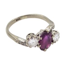 18ct white gold three stone oval ruby and round brilliant cut diamond ring, with diamond set shoulders, stamped, ruby approx 1.15 carat, total diamond weight approx 0.55 carat, in silver top ring box by The Victorian Ring Box Co, Edinburgh 1993 