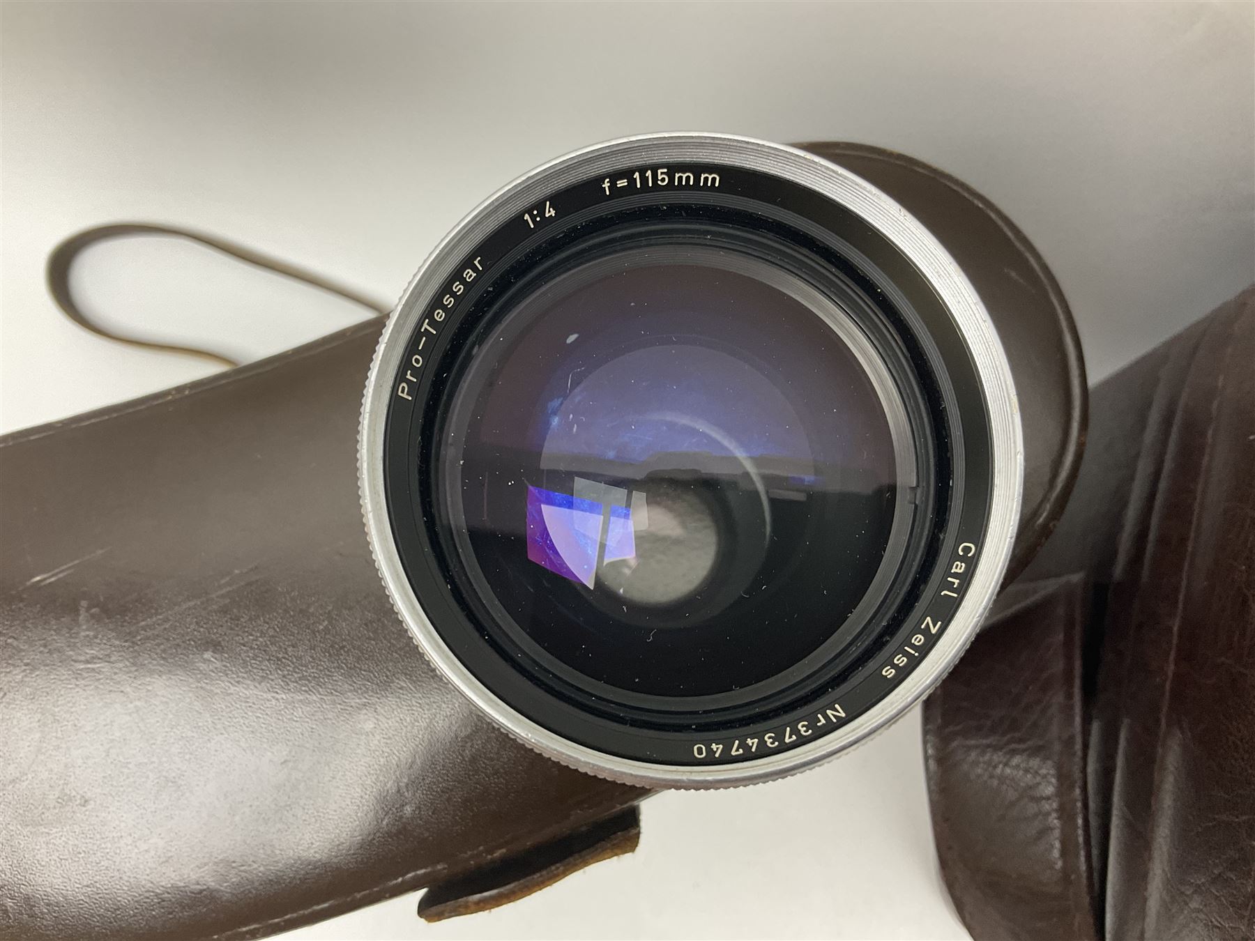 Four Zeiss Ikon camera bodies, to include, Contaflex Super B camera body, serial no. B31591, with 'Carl Zeiss Tessar 2.8/50 lens, serial no.3425553, Contaflex Super BC camera body, serial no. P81728, with 'Carl Zeiss Tessar 2.8/50' lens, serial no 4822280, etc, together with three cased lenses; 'Carl Zeiss Pro-Tessar 1:4 f=115mm' lens, serial no 3734740, 'Carl Zeiss Pr-Tessar 1:3.2 f=85mm' lens, serial no. 3647764 and 'Carl Zeiss Pr-Tessar 1:3.2 f=35mm' lens, and other Zeiss Ikon equipment 