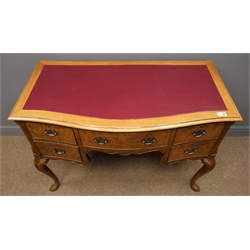  Queen Anne style walnut burr writing desk, red leather inset top, serpentine front, one long and four short drawers, shaped apron, carved shells, cabriole supports, W108cm, H76cm, D56cm  