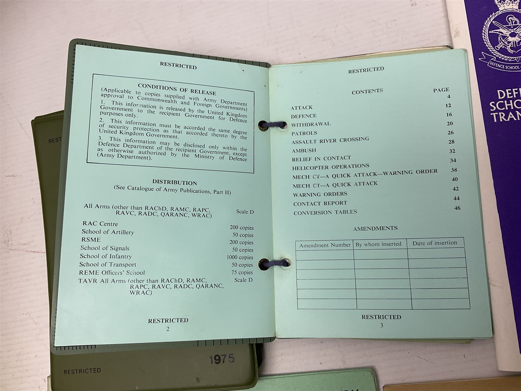 Collection of nineteen British Army booklets 1940s - 1970s including Small Arms Training 1944, various Infantry Training, Cadet Training Manual 1978, Signal Training, Commander's Aide Memoires etc; 1950s blue beret with Yorks Brigade badge; part travelling toilet set in cloth roll; all contained in pine box with webbing straps
