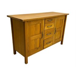 Laura Ashley - 'Milton' light oak sideboard, fitted with four central drawers flanked by two panelled cupboards, on square supports