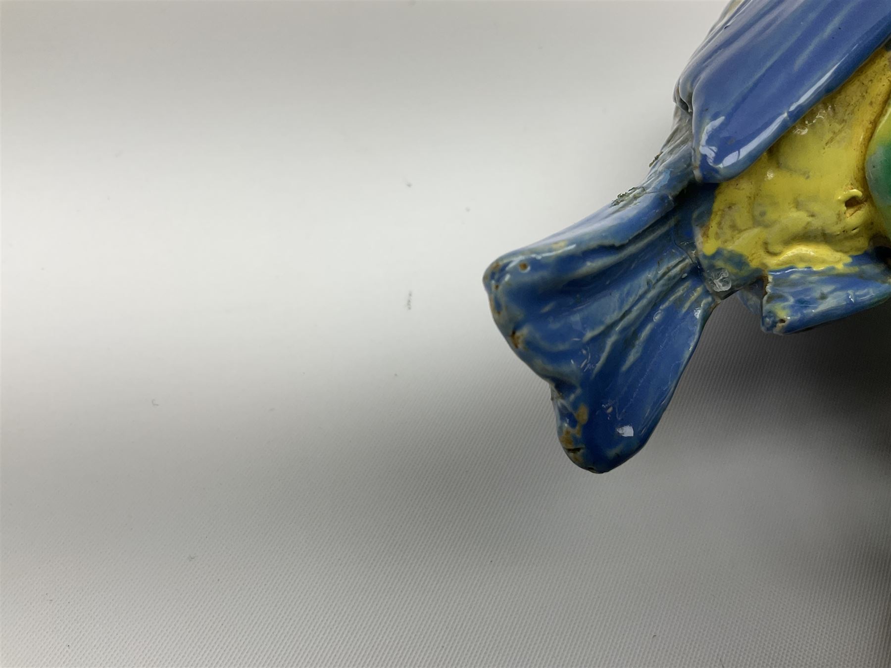 Minton majolica leaf dish, modelled as a Blue Tit perched on a branch with acorns and an oak leaf, date cypher for 1868, impressed marks beneath, L21cm. 