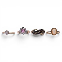Four 9ct gold rings, including cameo and three stone set examples