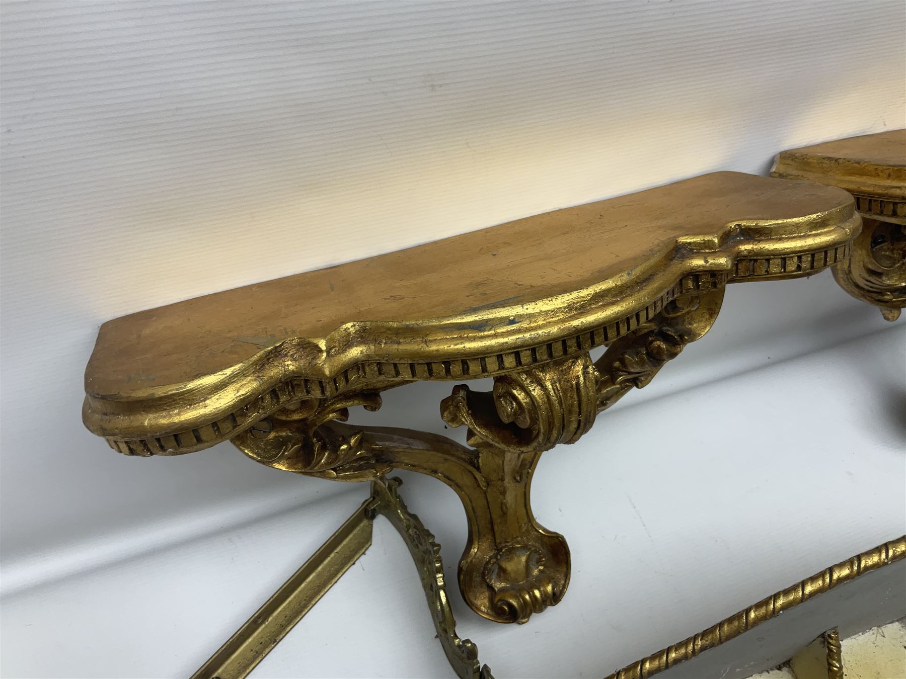 Five various giltwood and other hall brackets, one with marble top; and Viking ship table lamp