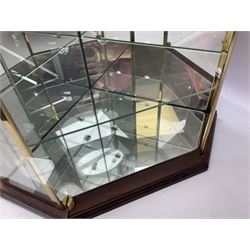 Swarovski Crystal Masquerade trilogy; 1999 Masquerade Pierrot, 2000 Columbine, 2001 Harlequin all with accompanying plaque, stand and original box, together with a glass display case with mirrored back and sides 