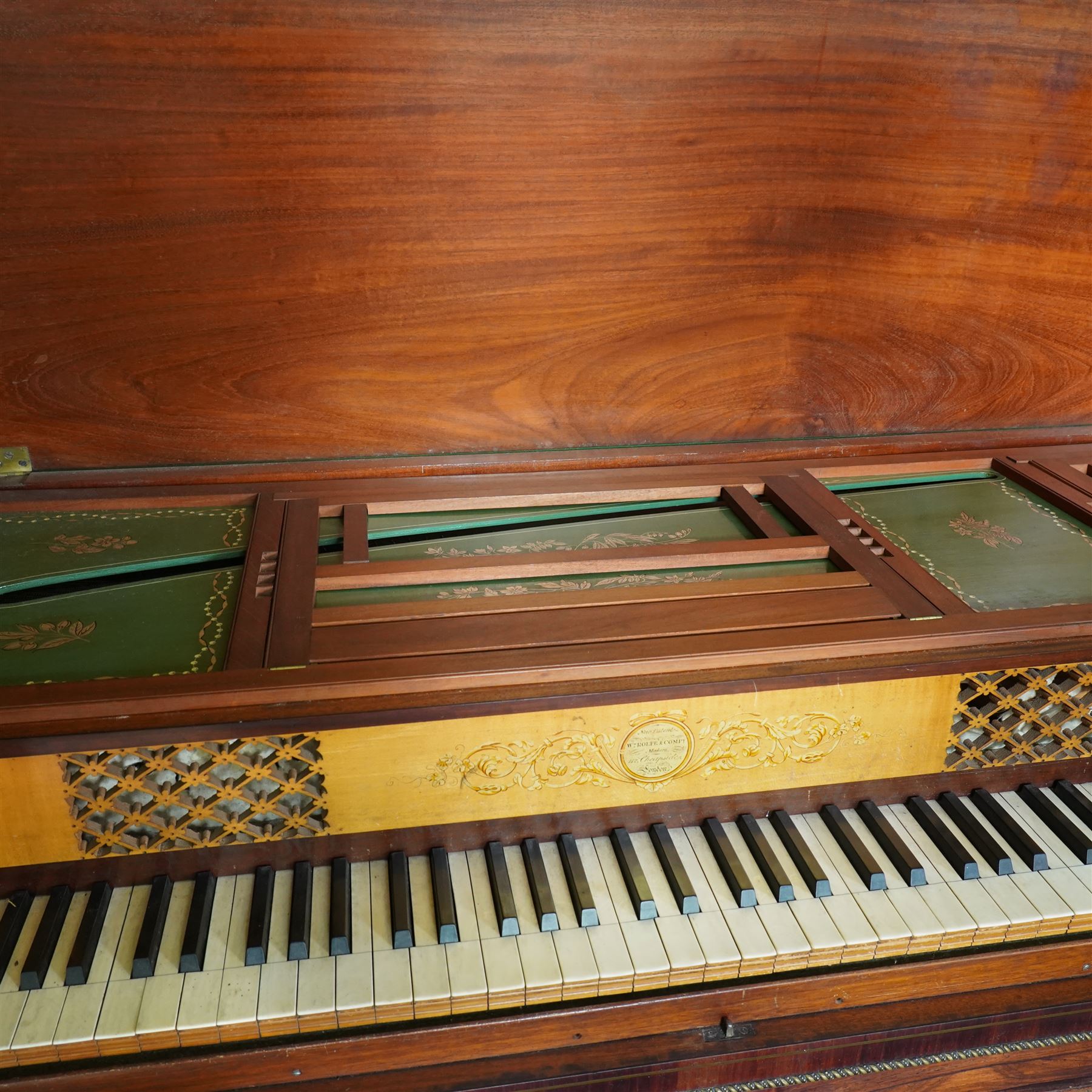 Early 19th century George IV Square Piano by William Rolfe & Co, 112 Cheapside, London, c1821. Mahogany veneered case with rosewood crossbanding and brass stringing, with sustain pedal and reeded legs on a tapered spiral with brass capitals, with three music draws beneath and a folding duet music stand, nameboard with makers name on a round gilt medallion and open silk backed fretwork to the ends, serial No 6699, double strung, English double action with 68 ivory and ebony keys, F1-C7. original strings, hammers and dampers, soundboard and bridge in good condition, with original makers written instructions on regulating the action and tuning the piano attached to the inside of the instrument. In good condition, however the action is in need of regulation and tuning.
William Rolfe is thought to have been in business between 1785 and 1828. 
Given the intricate nature of these historic instruments, specialist support will be available if required, to assist successful buyers with safe removal and onward handling. Price upon application.


This item has been registered for sale under section 10 of the APHA Ivory Act Reference PB6GL6SZ