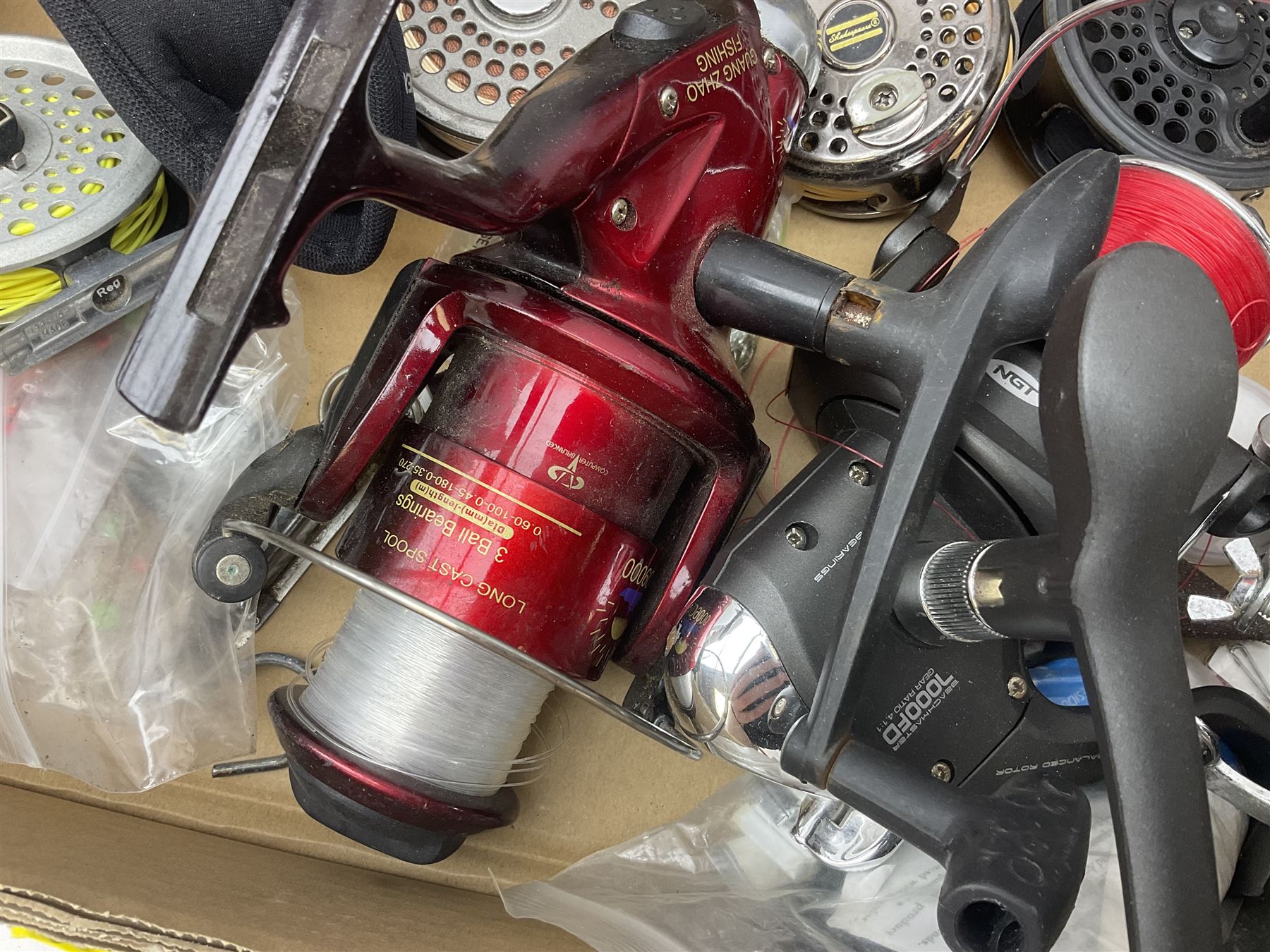 Quantity of fly and sea fishing rods and accessories, to include Shakespeare Boat 210 rod, Daiwa rod and others, and Guang Zhao FLD9000 course fishing reel, Beachmaster 7000FD, Rimfly II amd Penn Super Mariner, tackle etc