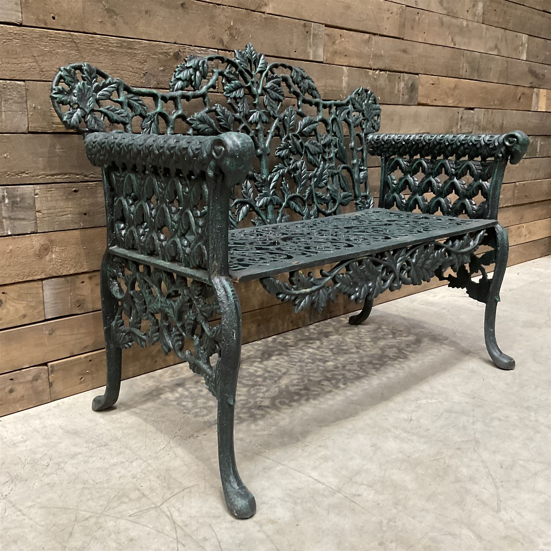 Victorian design heavy cast iron garden bench, ornate shaped back with rope twist and ramshead arms H88cm, W100cm