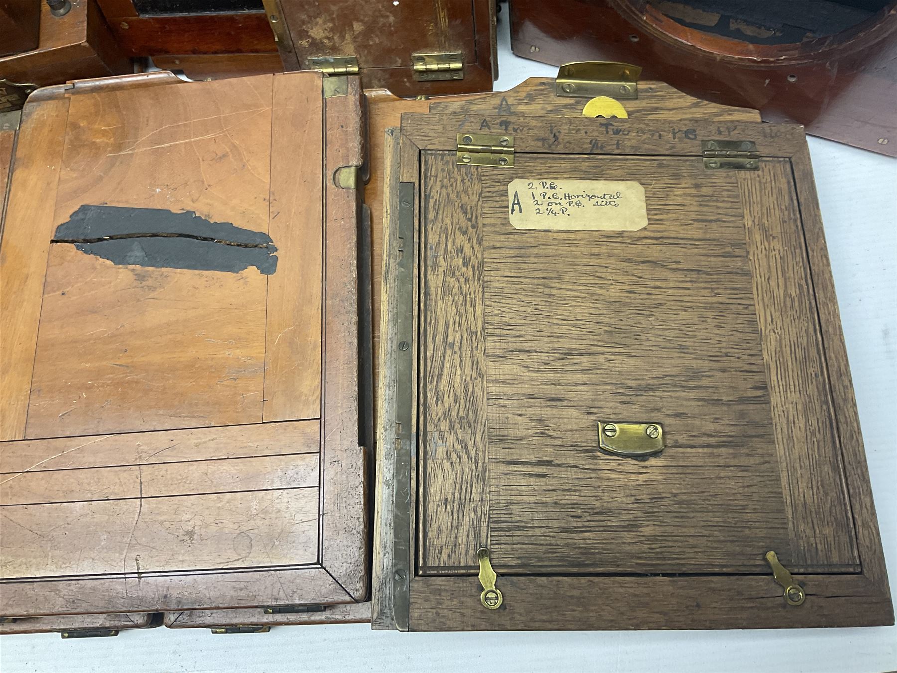 Collation of folding plate cameras of various sizes folding plate in mahogany and lacquered brass, together with camera plates and slides
By vendors repute some slide are from the Gandolfi workshop