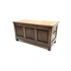 Late 20th century oak blanket box, moulded hinged lid over triple linenfold panelled front