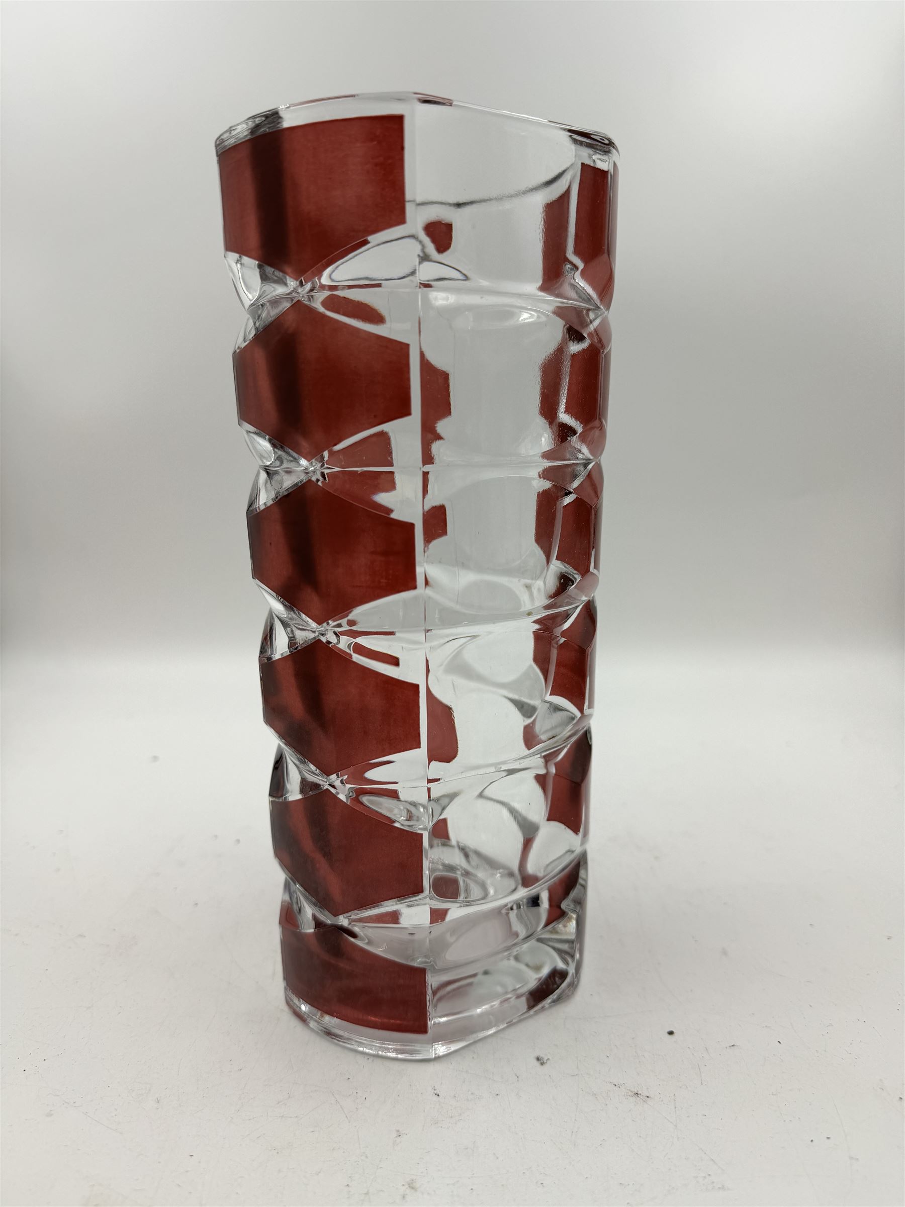 Sklo Union clear glass labrinth vase by Frantisek Vizner, together with two Luminarc geometric cranberry glass vases,Whitefriars style vase in the tangerine colourway, and one other 