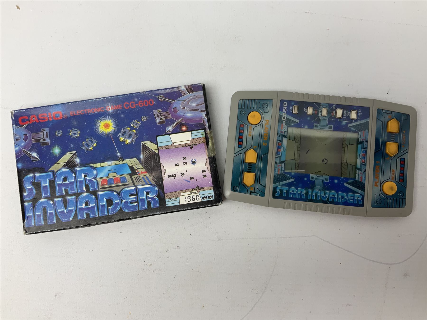 Collection of retro handheld games, including Nintendo Game & Watch ‘Snoopy Tennis’ (1982) and ‘Squish’ (1986) both with instruction booklets, Casio CG-600 ‘Star Invader’ with box, 3 in 1 LCD cartridge game including ‘Soccer’, ‘Invader’ and ‘Bomb Finder’ games, and two Grandstand ‘Pinball Wizard’ (1988) games, both with original boxes