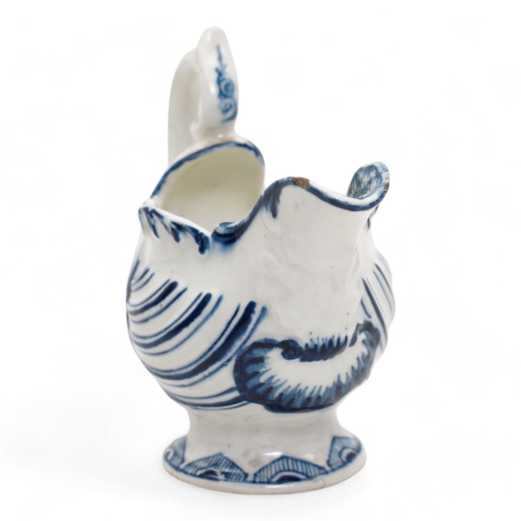 18th century Derby blue butter boat, circa 1770, of helmet form, moulded with shells and dolphin lip, on pedestal foot, H8.5cm x L9.5cm 