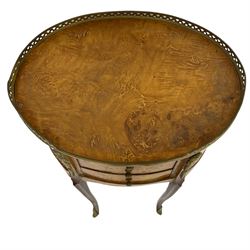 Late 20th century French design figured elm and bedside table, raised pierced gilt metal gallery over oval top, fitted with three mahogany lined drawers flanked by gilt metal mounts of female mask and foliate form, on cabriole supports