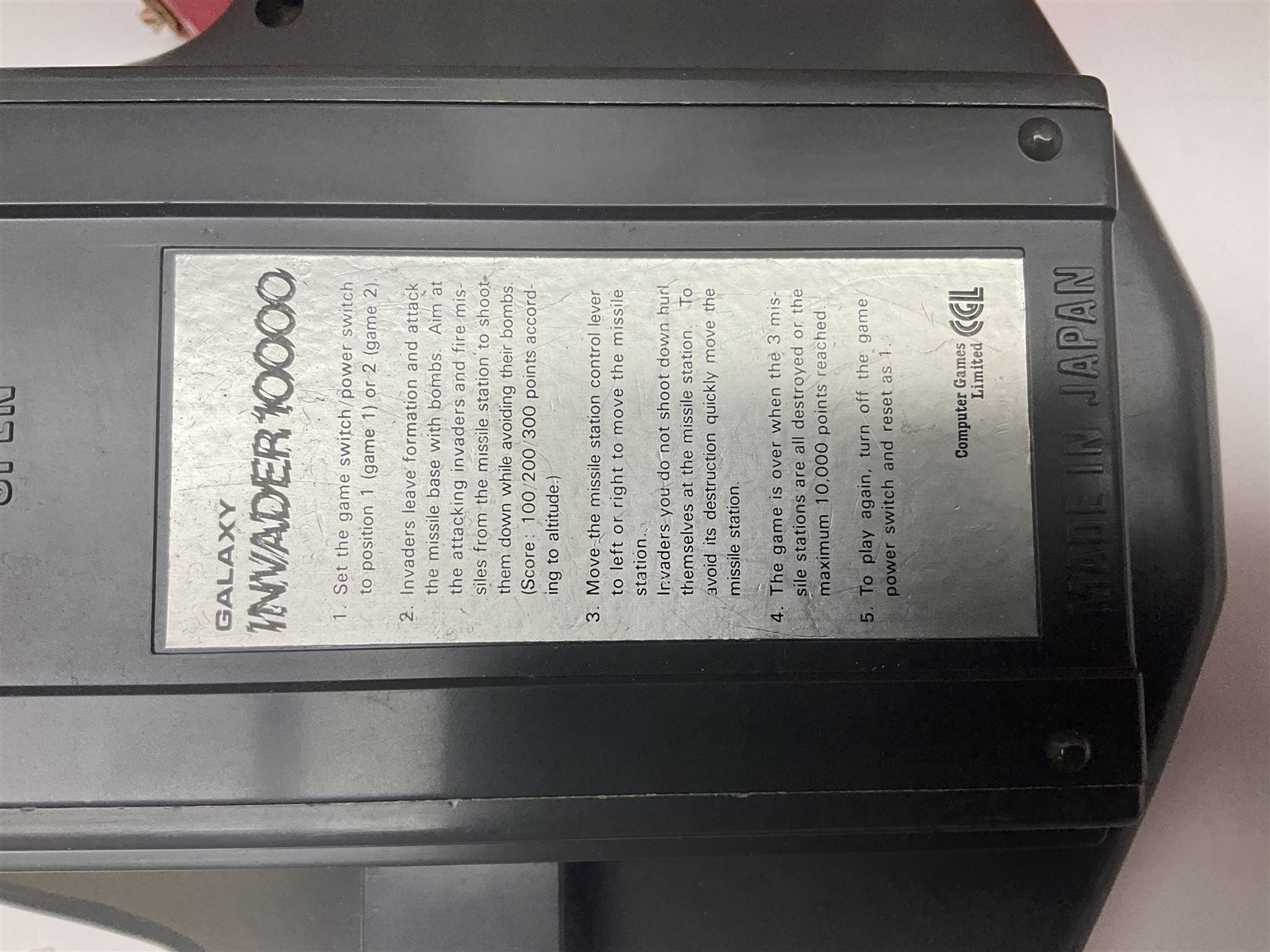 PMS Lightning 1:8 scale remote control racing car; Soma Sonic Man battery operated electronic sounds and light action figure; and CGL Galaxy Invader 10000 computer space battle game; all boxed (3)