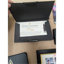 Star Trek collectables, including Danbury Mint '22ct Gold Card Collection', PCS Stamps and Coins Official US Postage Celebrating The Original Star Trek Series, Star Trek St Vincent and Grenadines first day cover collection, four stamp sets and a framed set of similar stamps, commemorative coins, Star Trek The Experience Las Vegas coin, three commemorative 'gold stamps' and three albums of collectors cards and telephone cards