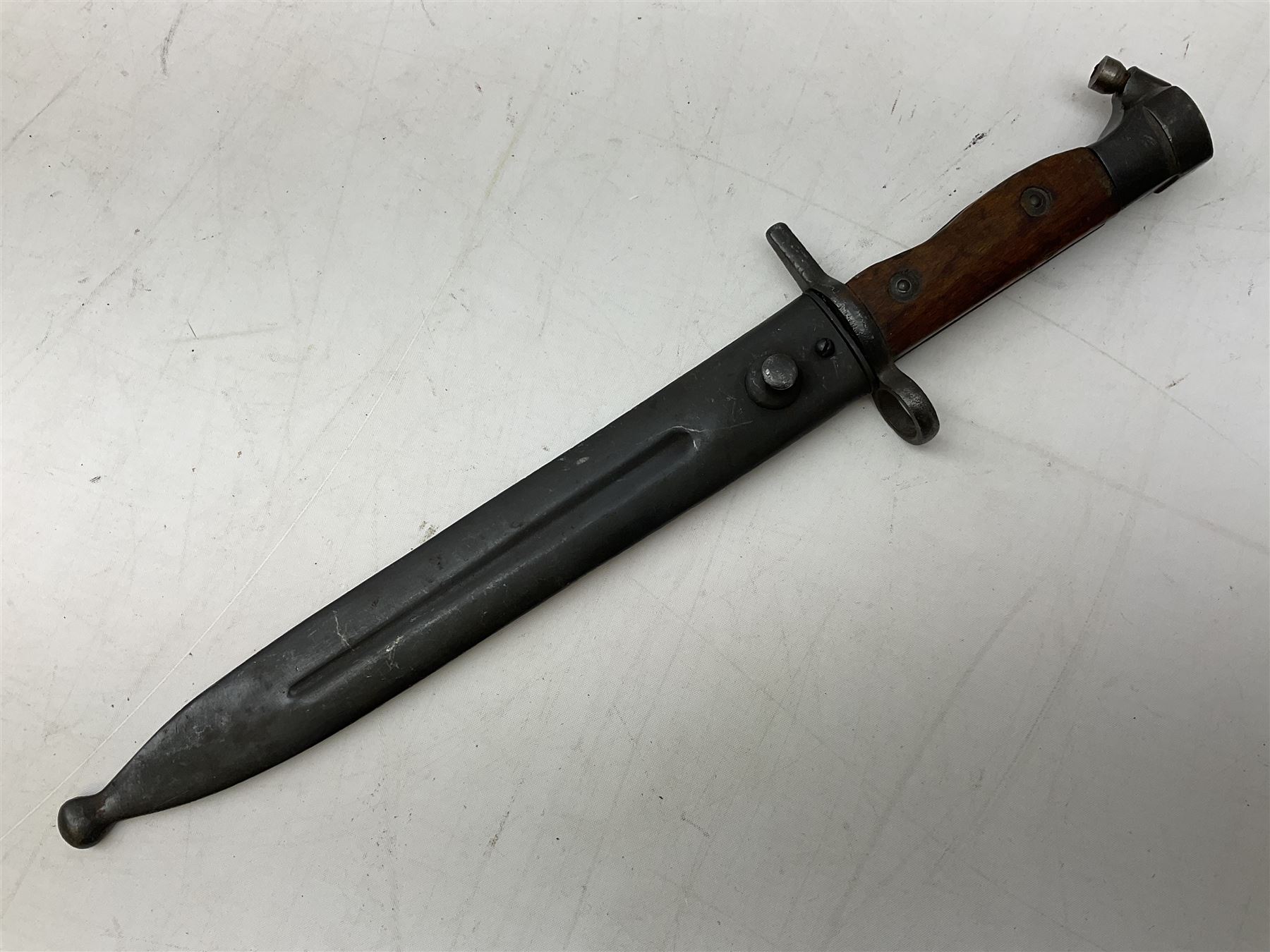 Swiss Model 1957 SIG rifle bayonet by Wenger with 23.5cm steel blade numbered 350857; in plastic scabbard with leather frog stamped GSCH 85 L38cm overall; and Egyptian Hakim rifle bayonet with the same script number to the grip and steel scabbard (2)