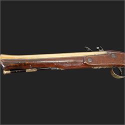 English flintlock blunderbuss, circa 1780 by R. Sutherland of London, the 32cm brass barrel with proof marks and London to the top, with original ramrod with brass tip below, the lock engraved Sutherland, walnut stock with brass butt plate, steel trigger guard with acorn finial, overall L70cm  