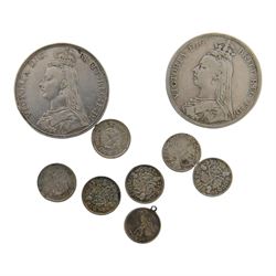 Two Queen Victoria 1889 silver one crown coins, six pre-1947 silver threepence coins, and a small silver 'Thirsk' pendant