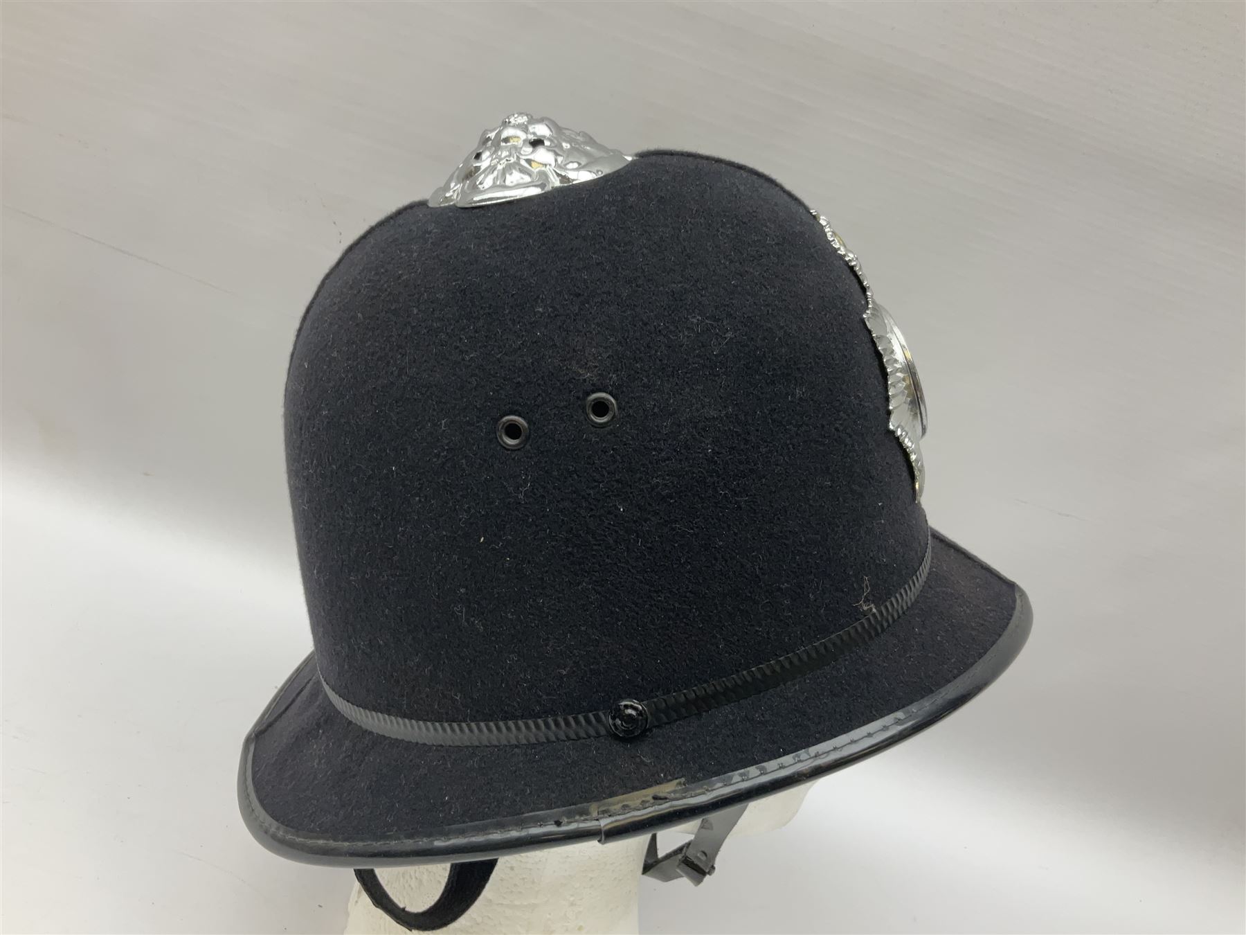 British Transport Police Custodian helmet with Queen's Crown plate; Hiatt & Co ebonised hardwood patrol truncheon; and pair of Hiatts 1960 hand-cuffs (3)