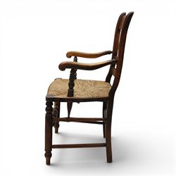19th century elm chair, with curved top rail and bobbin turned spindles, woven rush seat, on turned legs united by front stretcher