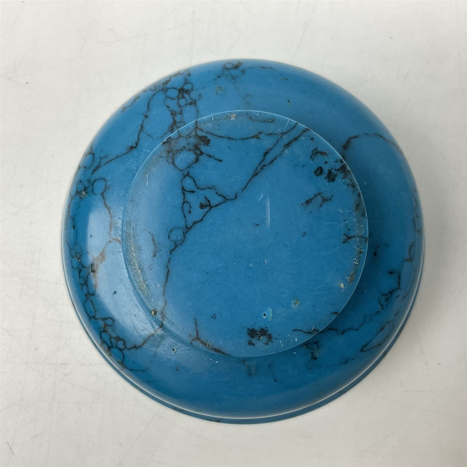 Carved single piece turquoise bowl with fluted rim, upon a raised footed base, D10cm, H5cm