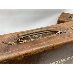 Early 20th century leather suitcase marked to the top 'Major P.M. Newton R.E. Crossways, Bridlington, East Yorkshire' 60 x 40cm; another similar leather suitcase marked W.D. to the lid; three post-WW2 respirators; and three unopened pairs of British Army N.B.C. (Nuclear Biological Chemical) No.1 Mk.III Trousers Protective (8)