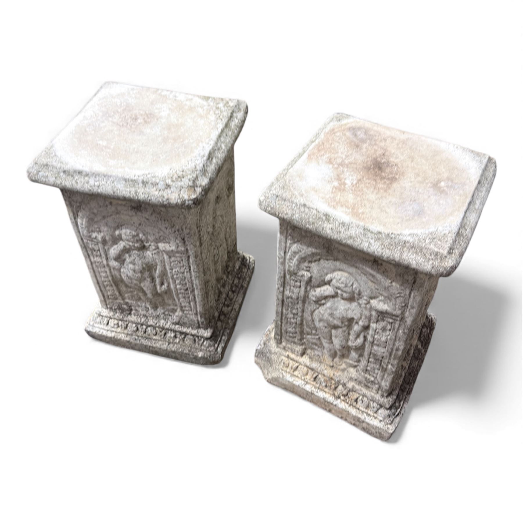 Paid of square cast stone plinths with a classical design