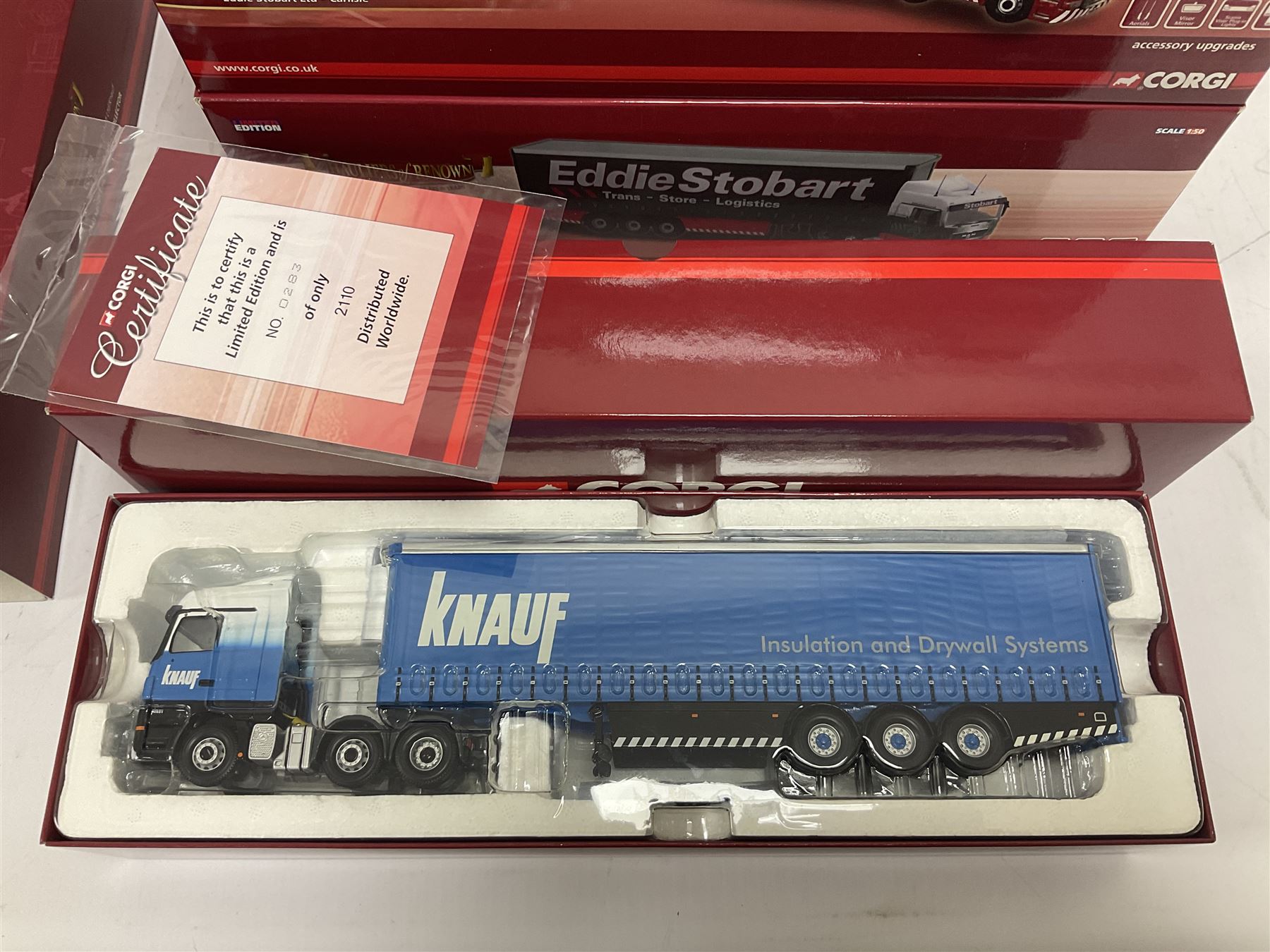 Corgi Hauliers of Renown - four limited edition 1:50 scale Eddie Stobart heavy haulage vehicles comprising CC13812 Mercedes-Benz Actros Curtainside; CC15002 Iveco Stralis Curyainside; CC13722 Scania R Fridge Trailer; and CC15202 MAN XLX; all boxed (4)