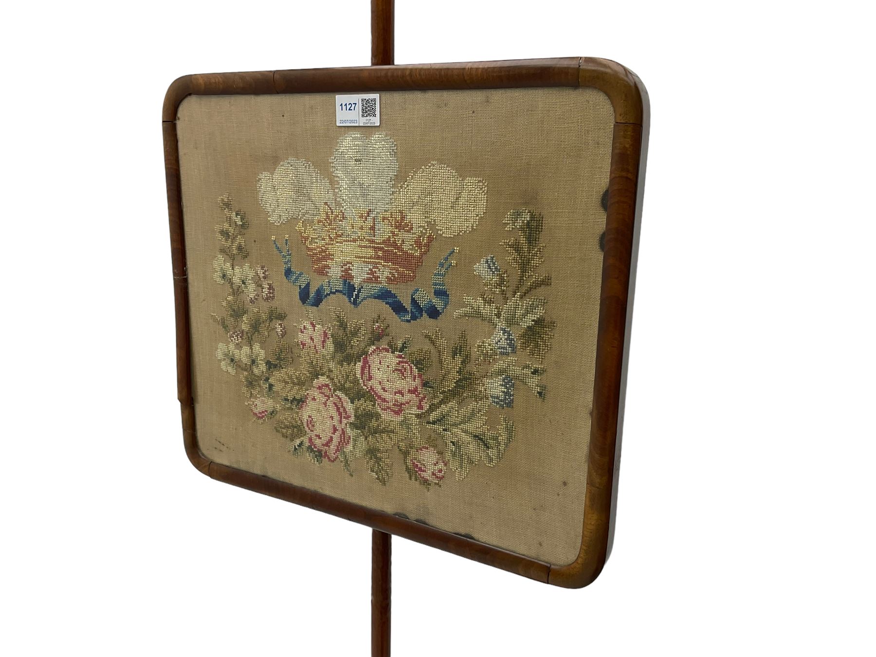 Victorian mahogany pole screen, with needlework panel depicting the Prince of Wales feathers and floral garland, vasiform pole with lappet decoration, on a concaved triangular platform with compressed bun feet
