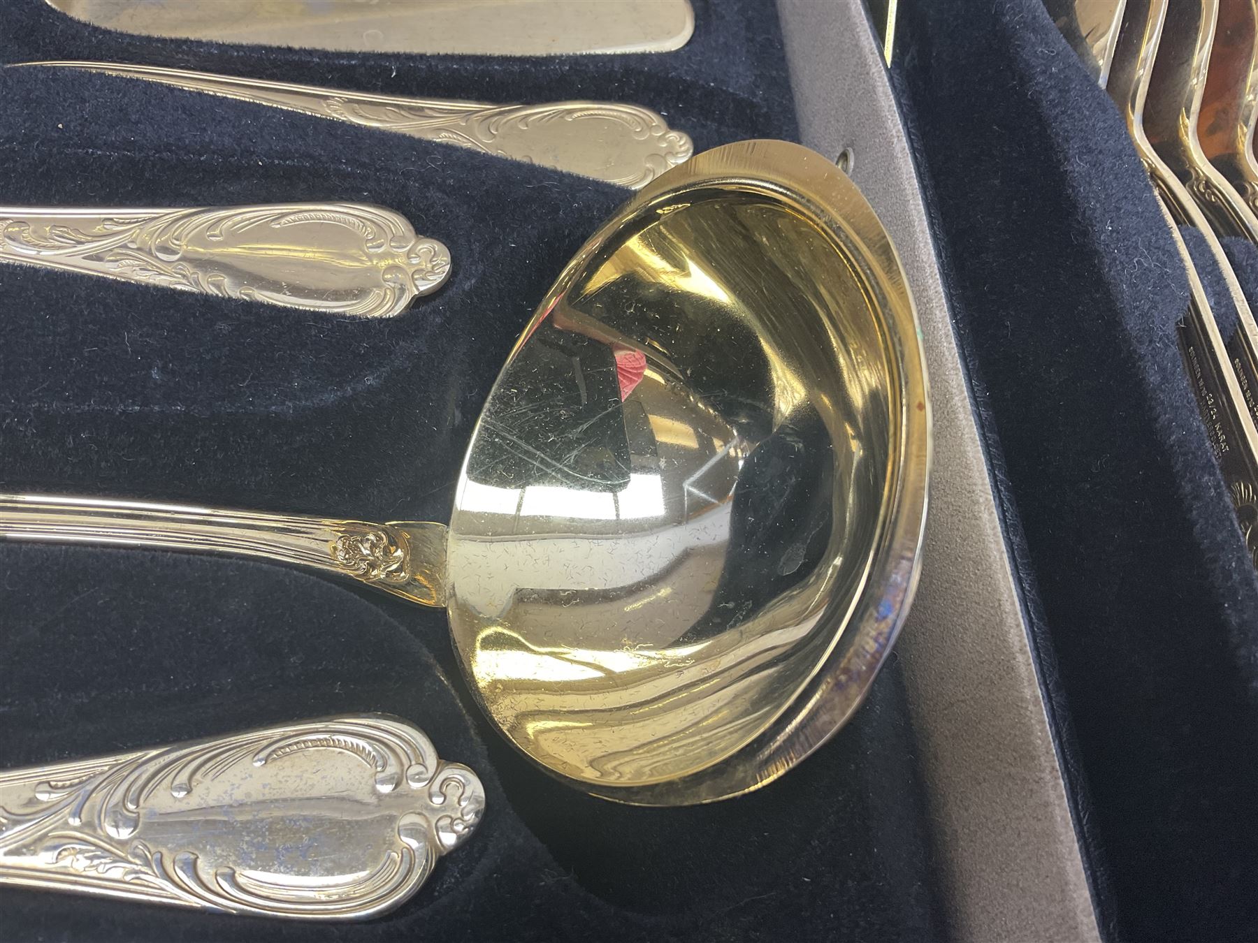 Bestecke Solingen canteen of gold plated cutlery for twelve place settings, including ladle, cake slice and serving spoons, contained within a briefcase, together with a matching set twelve of Bestecke Solingen gold plated fish knives and forks, in fitted case 