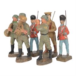 Lineol two Danish guardsmen, together with three German WWI bandsmen and one Japanese infa...