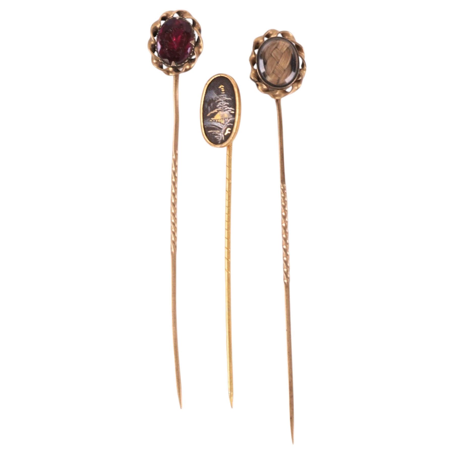 9ct gold photo pendant and three gold plated stick pins, including one stone set and one hairwork example