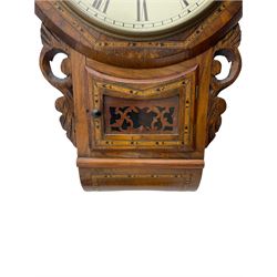 An American drop dial wall clock c1890 with a 16” walnut bezel with hexagonal parquetry inlay, glazed pendulum box with corresponding inlay and carved ear pieces, painted steel dial with roman numerals and minute track, steel Maltese-cross hands within a flat glass and spun brass bezel, with an eight-day striking movement striking the hours and half hours on a coiled gong. With pendulum and key H65cm
£60-80.


